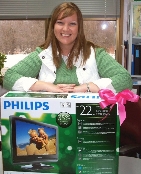 Coordinator of OCO’s Cancer Services Program Partnership Carolyn Handville displays the 22” Flat Screen Television that the program will be giving away to a lucky client who receives a free cancer screening through the program now through Feb. 28.