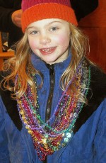 Abby Brancato shows off all the beads she has collected during Warm Up Oswego activities.