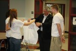 Aubertine receives an SOS t-shirt.