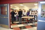 The meeting nears its end in the cafeteria.
