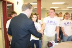 Barclay and Welling share a handshake.
