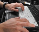 safe stop writing ticket A police officer inputs data for a ticket Thursday during Operation Safe Stop.