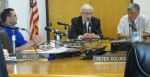 BOE tschudy Jim Tschudy, center, makes his case at Wednesday's special meeting of the Oswego school board. At left is board member John Dunsmoor. At right is board president Sam Tripp.