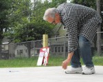 BL artist William Mihalko Artist William Mihalko creates the shape for the hopscotch game at one of the activity areas along the Learning Trail.