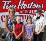 FP Hortons_(5) Two of the five Fitzhugh Park Elementary students who are headed to the Tim Horton Foundation camp are sent off with well wishes from their principal and the manager of the Oswego Tim Horton’s store. From left are Principal Donna Simmons, Kyle Maitland, Mariah Morley and Tim Horton manager Jennifer Catalone.