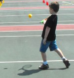 TENNIS eye on the ball Jacob Holmes keeps his eye on the ball as he follows through on his return shot during the beat the pros challenge.