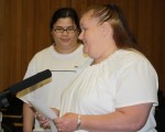 Shirley Slate reads from her essay as daughter Caroline Aguzar looks on.
