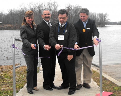 Phoenix ribbon Officials snip the ribbon to officially open Phoenix’s new kayak launch site Tuesday afternoon. From left are New York State Canal Corporation Director Carmella Mantello, Village of Phoenix Mayor Anthony Fratto, Village Administrator Jim Hayes and Vice Chair of the Erie Canal Corporation Russell Andrews.