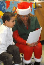 ELVES Alijah and J-Lo Alijah Champlin has a personal reply to his letter to Santa read to him by J-Lo, one of the elves that visited his kindergarten class.