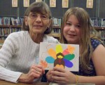 Fulton School Mentoring Sandy Weston, a mentor in the Fulton School Mentoring Program (left) and her mentee BriAnne Redman display one of the many cards designed by participants in the mentoring program that were delivered to seniors receiving a meal from Meals on Wheels.