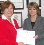 G_&_C_Donation Diane DiSanto, director of operations at G & C Food Distributors & Brokers (right), presents Diane Cooper-Currier, OCO executive director, with a check for $10,000. The company feels a strong connection to Oswego County because many of its employees live there.