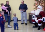 Masons Christmas Party Youngsters wait in line to visit with Santa Claus