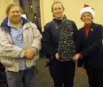 neighborhood watch xmas party Getting in the holiday spirit at the Neighborhood Watch program’s family Christmas party are, from left, Ernie Lehmann, volunteer; Oswego Police Officer Laura Burger; and Betty Gray, program coordinator.
