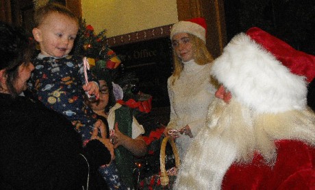 tree nathan Nathan Wallace thanks Santa Claus for the candy cane.