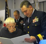 fillingham and admiral Parks Rear Admiral Mike Parks, commander of the Ninth Coast Guard District, reads the citation to Edward Fillingham on Tuesday afternoon.