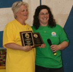 Autism 2010_Award_Picture Pictured is Theresa Familo, right, of OCATF presenting the award to Sue Squires. Squires is accepting the award for Sandy Silky and Laurie Doss who were not able to be present.