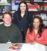 Catholic Charities Welcomes Parent Educators Supervisor of Catholic Charities of Oswego County’s Parent Education Program, Andrea Burritt, standing, welcomes new parent educators, Ken Dennison and Angela Smith to the program.