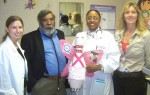 Fulton Heath Center Welcomes Guardian Angel The honorary Head Pin for OCO’s Annual Bowl-a-Fun, “The Pink Guardian Angel,” recently visited OCO’S Fulton Health Center. From left are Heidi Washington, P.A.; Dhanraj Soogree, M.D.; Marie Desravines, M.D.; and administrative assistant, OCO Health Division, Penny Halstead.