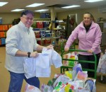 bliz bag Waite_&_Nellis Patrick Waite and Colette Nellis of OCO load Blizzard Bags that will be delivered to seniors participating in OCO’s home delivered meals program.