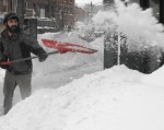 snow emil shovels Emil Christmann shovels the sidewalks around the river’s end bookstore.