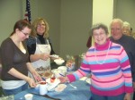 Fulton Mills VD Luncheon Residents of Fulton Mill Apartments enjoy a special Valentine’s Day Soup and Salad Luncheon courtesy of Catholic Charities of Oswego County. From left are: Erika Buck, an intern with Catholic Charities; Director of Catholic Charities’ Emergency Services Program, Helen Hoefer; and Fulton Mill Apartment residents Priscilla Marcino and Leon Smith.