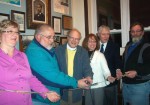 H. Lee White Marine Museum Exhibit Unveiled Mercedes Niess, executive director of the H. Lee White Marine Museum,left, is joined by representatives from Oswego Town in unveiling the museum's newest exhibit.