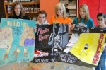OMS DanceArt_(2) Displaying some of the posters that were created by Oswego Middle School eighth grade art students are Brenna Riley, Taylor Montgomery, Kellie Gorman, Meghan Anderson and Rana Al-Salameh.