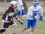 lax 20 Oswego John Phillips (20) on defense for the Bucs.