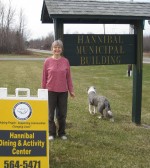 Hannibal Senior Activity Site Relocates Rosemary Kellogg, manager of OCO’s Senior Dining and Activity Center in Hannibal and Hannibal Mayor Fred Kent’s dog, Benny, stand by the entrance to the center’s new site in the Hannibal town Hall, 824 County Route 34.