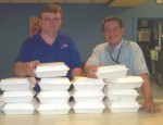 Chicken BBQ, Car Wash To Benefit Catholic Charities Dan Smith (left), general manager of Lakeview Lanes in Fulton and Jonathan Gilmore of Catholic Charities of Oswego County prepare take-out boxes for the upcoming barbecue and car wash.