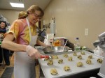 OCO Mental Health Division Raising Awareness Carolyn Hart, coordinator of OCO’s Mental Health Department, prepares to bake some homemade chocolate chip cookies for the Community Organizations Fair held recently at Breitbeck Park in Oswego. In the background is Peg Thompson, mental health transitional living supervisor with OCO.