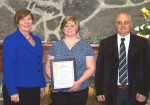 OCO_Vol_of_Year Executive Director of Oswego County Opportunities, Diane Cooper-Currier presents the OCO Howard Wilcox Volunteer of the Year Award to Mike and Patti Tryniski. From left are: Cooper-Currier, Patti Tryniski and incoming president of OCO’s Board of Directors, Joe Caruana.