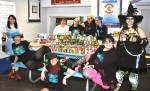 Oz Roller Girls Roll Out Community Support Meals via wheels - members of the Oz Roller Girls present Major Corinne Hayes of the Oswego Salvation Army with canned goods and other non-perishable food items collected from the community to support the local organization's food services. A portion of proceeds from that bout also supported the local Veterans Administration Outpatient Clinic.