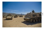 Armored vehicles line up in a convoy to move from Madina-Jabal, a camp set up at the National Training Center on Fort Irwin, Calif., to give troops a realistic environment to train for an upcoming deployment to the Middle East. (Photo by Staff Sgt. Christopher Griffin)