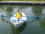 BUILD A BOAT IN JUST 3 DAYS Chloe Martin of Oswego tests the dory lark that she and her family built at one of the H. Lee White Marine Museum's Family Boat Building Weekends.