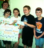 jogging suits Pictured are: Kids Care Club advisor, Marylynne Maxwell with Jake Hauser, Claudia Chetney, Andrew Scaccia, and Emily Bradshaw.