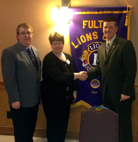 Dennis Goss, licensed funeral director, Foster Funeral Home, was the featured speaker at the Fulton Lions Club March 14 meeting. Goss explained the advantages and components of funeral pre-need planning. Fulton Lions Meeting Program Co-chairs James and Diane Sokolowski (left), thank Goss for his presentation. The Fulton Lions Club, also know for their Lions Loot Sweepstakes and Labor Day Duck Derby, provides financial assistance for those in need of eyeglasses, eye exams and hearing aids to residents in the Greater Fulton area.  The club is holding its first Comedy Night event at the Polish Home, on April 12. Tickets are available at Devine Designs and the Fulton Medicine Place. For further information on Fulton Lions: www.FultonLionsClub.org or visit the Fulton Lions Club page on Facebook®.