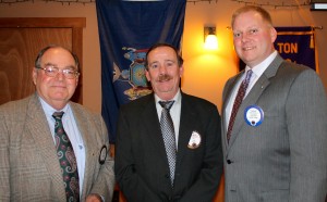 Fulton Lions Steve Young (left), and Dave Morrell (center), were for 20 years and 30 years of club service respectively at the club’s April 11 meeting. Here President David Dingman congratulates them.