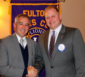William Lynch, (left), superintendent, Fulton City School District, presented an overview of the proposed 2013-14 district budget at the Fulton Lions Club April 11 meeting. Here President David Dingman thanks him.