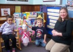 OCO Head_Pin_at_Pinewoods The Pink Guardian Angel visits the Pinewoods location of OCO’s Head Start Pre-K Program. From left are: Ciara Dillingham, Nathaniel Holmes and Head Start teacher Monica Wurster.