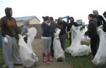SUNY Oswego students clean up around Wright’s Landing during the 2011 Canal Clean Sweep on Sunday, April 17.