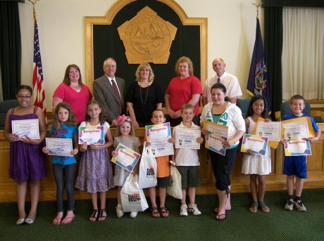 The Oswego County Fair Housing Council recently announced the winners of its 2011 coloring contest. Community Bank, Fulton Savings Bank and Pathfinder Bank each donated savings bonds as prizes. The winners also took home gift certificates provided by Lighthouse Lanes in Oswego. Pictured from left in front are Shameeka LaLiveres of Oswego, second place, ages 7-9; Felicity Jewels-Couch of Oswego, first place, ages 7-9; Cierra Dunning of Oswego, third place, ages 7-9; Harper McClave of Fulton, third place, ages 4-6; Alijah Champlin of Oswego, second place, ages 4-6; Mason Zych of Central Square, first place, ages 4-6; Madison Bell of Oswego, first place, ages 10-12; Crissa Cabanlig of Oswego, second place, ages 10-12; and Randy Allen Bills of Oswego, third place, ages 10-12. Pictured in the back row from left are Kathy Maino, Lighthouse Lanes; Kenneth Parrotte, Fulton Savings Bank; Dona Lee Falciatano, Oswego County Fair Housing Officer; Reyne Pierce, Pathfinder Bank; and Steven Gaffney, Community Bank.