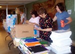 Volunteers from the Oswego County Teachers Association sort through school supplies collected during a previous United Way Stuff-A-Bus campaign. Members will once again join United Way volunteers in distributing school supplies from this year’s Stuff-A-Bus campaign.