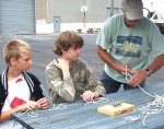 Dick Drosse of Minetto demonstrates knot tying techniques to visitors at a previous H. Lee White Marine Museum Canal Celebration event.