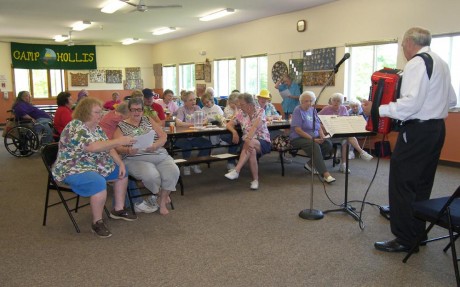 ACCORDIONIST PAUL RILEY of Williamstown entertained campers at the annual senior camping program at Camp Hollis in June. Campers sang along to a variety of traditional and old-time favorites as well as a selection of songs from “The Sound of Music.” This year marks the 21st year of senior camping at Camp Hollis. The next program takes place Sept. 12 and 13. For information or to register call the Oswego City-County Youth Bureau at 349-3451. 