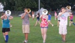 Mellophone and trombones work on getting the sound just right.