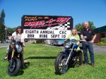 Committee members from the Child Advocacy Center’s 8th Annual Blue Ribbon Ride Against Child Abuse check out some new motorcycles as they meet with Mark Eagan of event sponsor, Wheel-A-Way Motorsports. From left are: Melanie Proper, Eagan and Karrie Damm, executive director of the CAC.