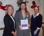 As one of the participating restaurants, servers at Good Golly’s will be wearing “Ask me how to get a FREE cancer screening” aprons, and distributing information on OCO’s Cancer Services Program. Pictured are: Carolyn Handville, coordinator of OCO’s Cancer Services Program (center) and co-owners of Good Golly’s, Lisa Lozipone (left) and Judy Sherman.