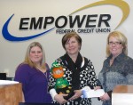 Diane Cooper-Currier (center), executive director of Oswego County Opportunities, receives a check for $1,000 from Empower Federal Credit Union for a “Building Dreams” sponsorship. At left is Shannon Mills, Fulton West (Route 3) Branch manager, and at right is Lisa Bradshaw, branch manager at Empower’s 520 S. Second St. location.