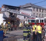 Crews assess the fire damage at the Pulaski VFW today.